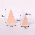 Two geometric peach-colored photo props for Cube Photography with varying sizes and dimensions