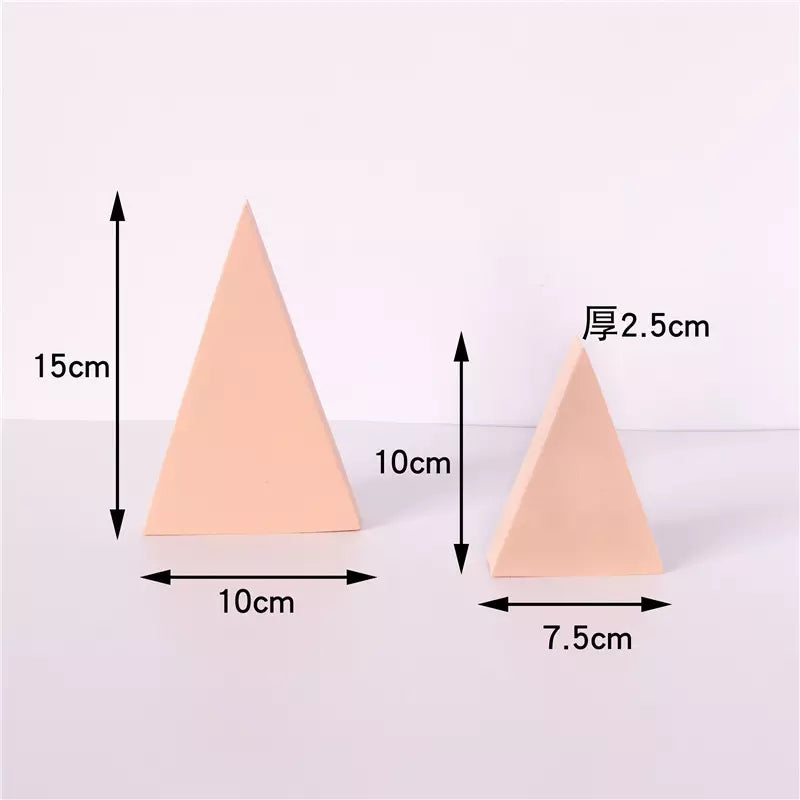 Two geometric peach-colored photo props for Cube Photography with varying sizes and dimensions