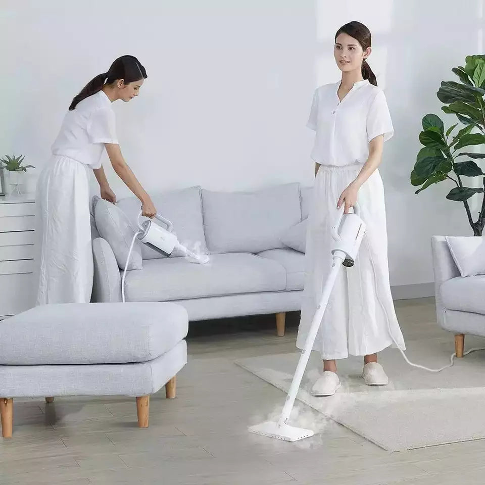 Woman using Handheld Home Mop Kit on floor while cleaning a living room with a sofa