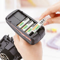 EBL 2300mAh AA rechargeable batteries being inserted into a black VMIDirect charger
