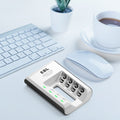 EBL 4-bay battery charger on desk near keyboard mouse and coffee cup for charging rechargeable batteries