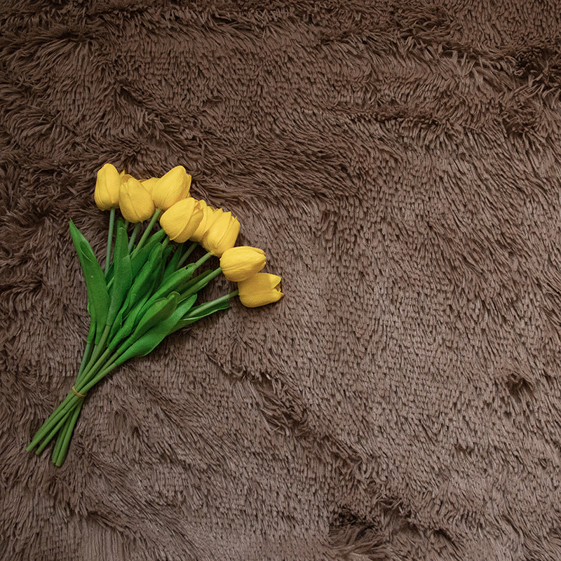 Faux Fur Makeup Prop Mat with a Brown Texture featuring a Bouquet of Yellow Tulips