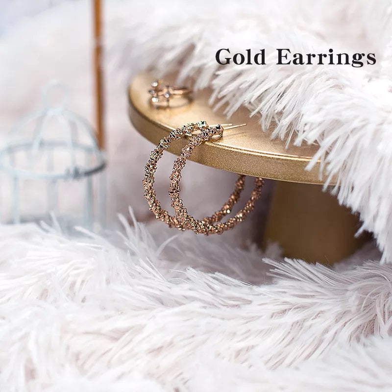 Faux Fur Makeup Prop Mat showcasing stylish gold earrings on a decorative stand