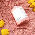 Faux Fur Makeup Prop Mat featuring a pink container of nourishing lotion for photo shoots