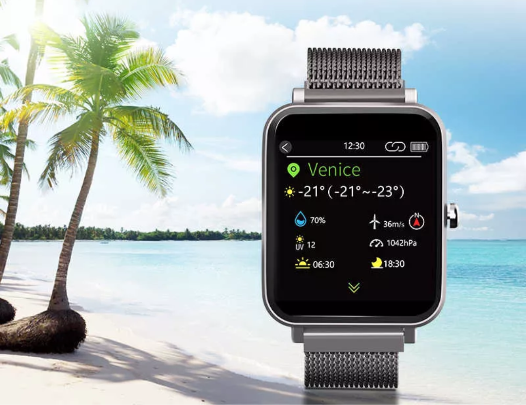 VMIDirect Watch Fitness Tracker displaying weather information by a tropical beach