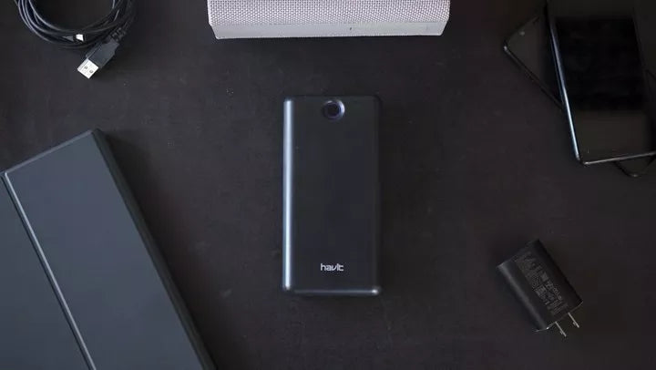 VMIDirect 20000mAh Power Bank in Black With Multiple Devices on a Table