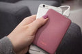 VMIDirect 5000mAh Power Bank in pink being used to charge a smartphone