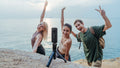 VMIDirect Waterproof Motovlogging Steady Cam on a tripod with friends posing by the water