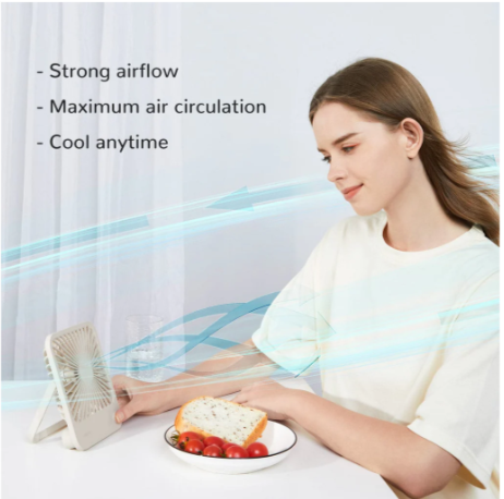 Woman using USB rechargeable desk fan with strong airflow and maximum air circulation