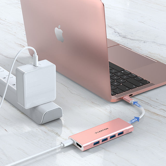 USB-C hub with 4K HDMI and four USB ports connected to a laptop