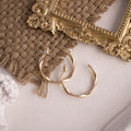 Elegant Linen Mat Photo Props with Gold Hoop Earrings on Textured Background