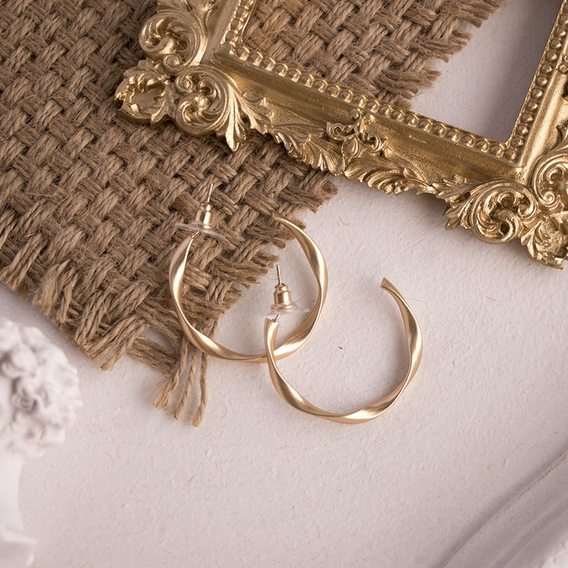 Elegant Linen Mat Photo Props with Gold Hoop Earrings on Textured Background