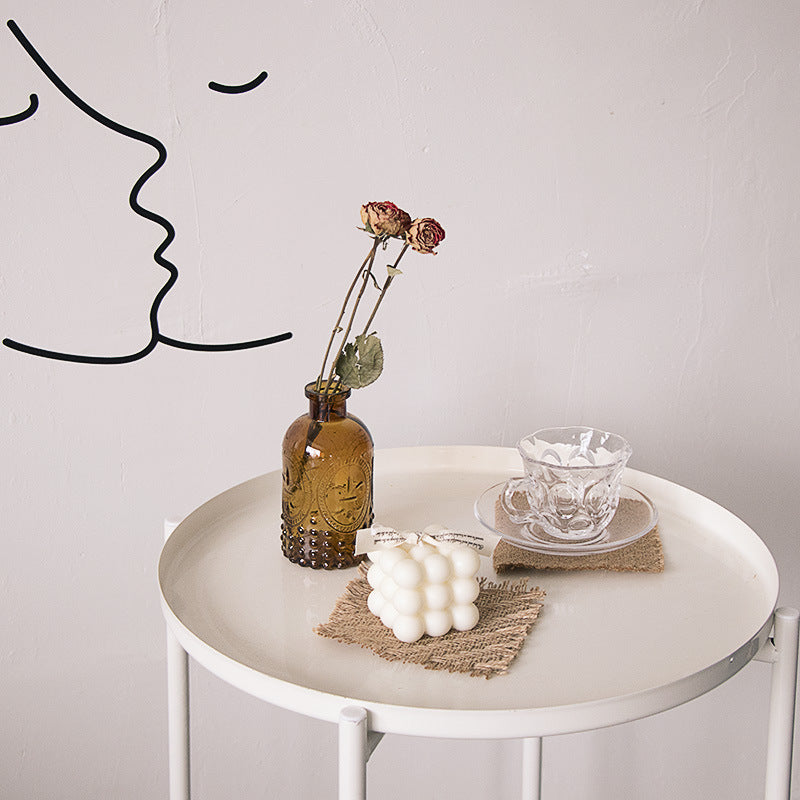 VMIDirect Linen Mat Photo Props on a white table with decorative items and artistic wall art