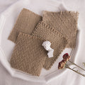 Four textured Linen Mat Photo Props arranged on a white plate for photography backgrounds