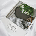 Stylish Magazines Card Decoration featuring a vintage camera and tulips on a gray surface