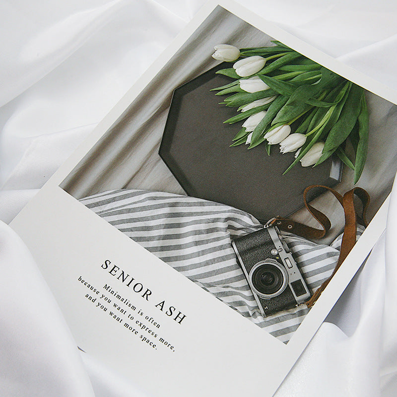 Stylish Magazines Card Decoration featuring a vintage camera and tulips on a gray surface