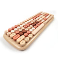 Mofii Candy BT keyboard for IOS and Android with pastel round keys in beige and peach colors