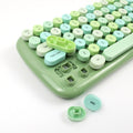 Mofii Candy XR wireless keyboard and mouse combo close-up of green and pastel keycaps with some keys removed
