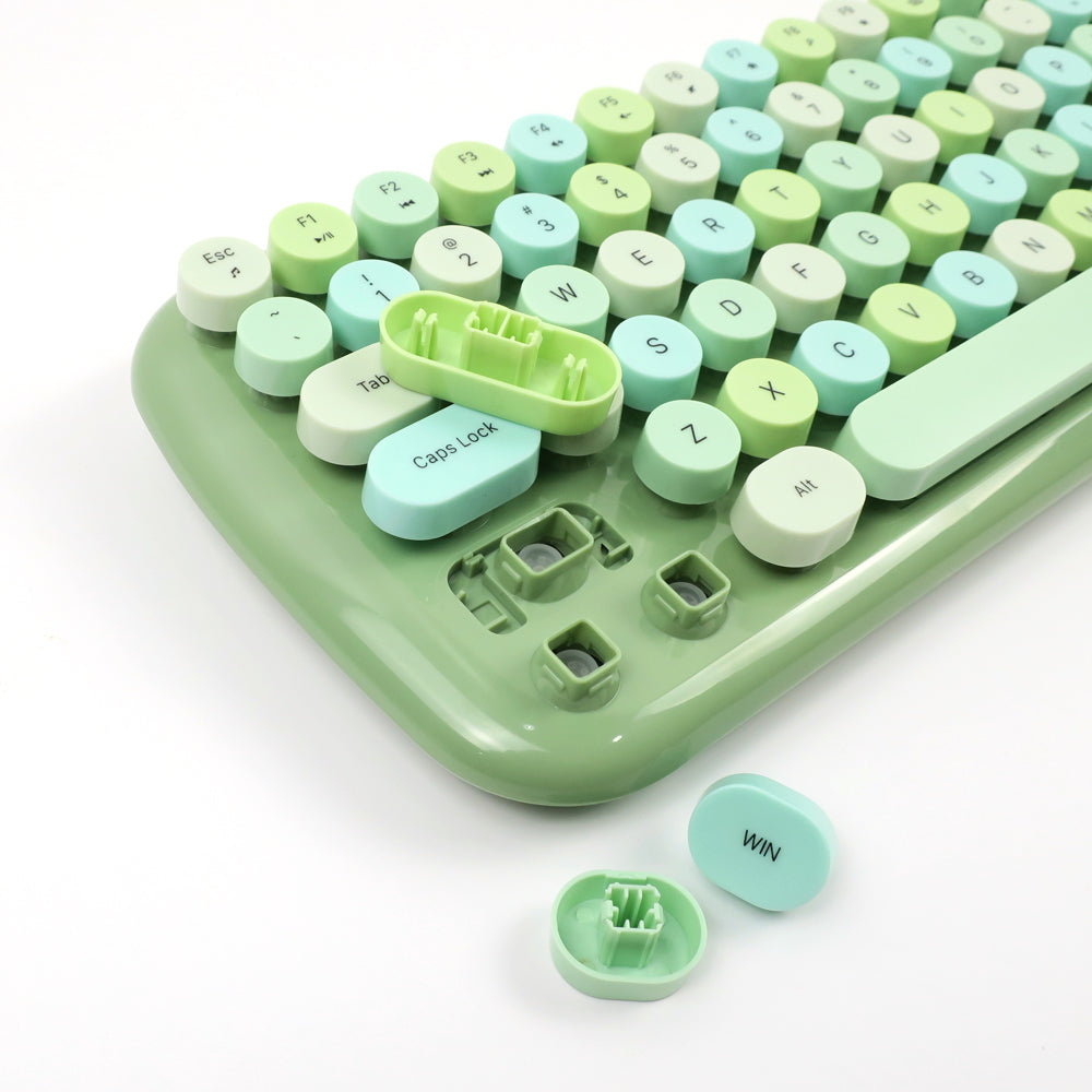 Mofii Candy XR wireless keyboard and mouse combo close-up of green and pastel keycaps with some keys removed