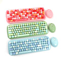 Three colorful Mofii Candy XR wireless keyboard and mouse combo sets in pink, green, and blue colors