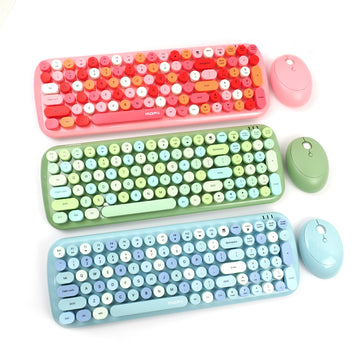 Three colorful Mofii Candy XR wireless keyboard and mouse combo sets in pink, green, and blue colors