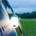 VMIDirect Portable Tourist Lamp hanging on a tent pole, providing bright light for camping adventures