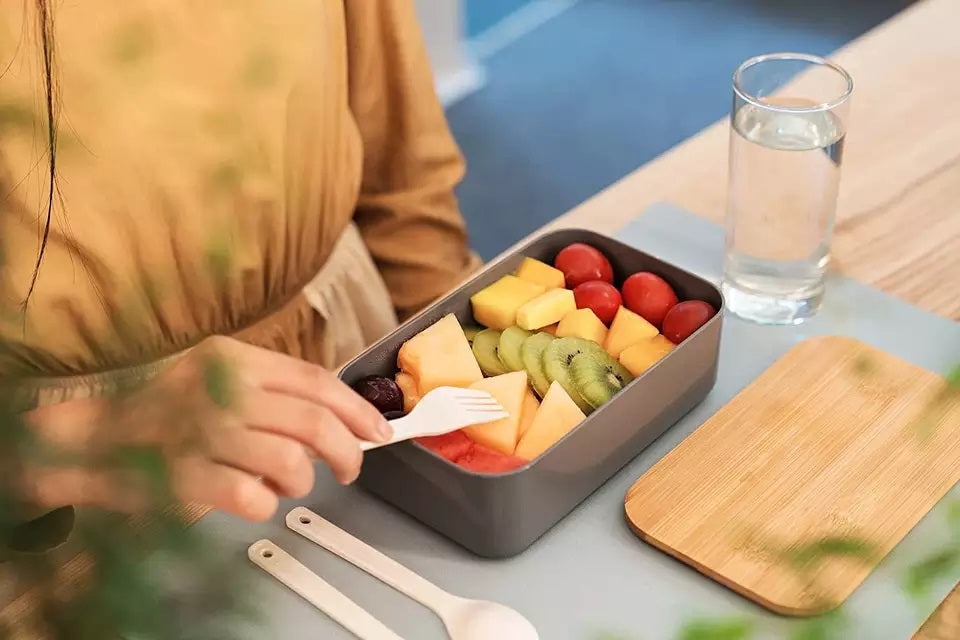 VMIDirect Portable Bento Lunch Box filled with fresh fruits and a fork on a table