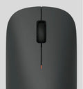Portable Mini Mouse in sleek black design with scroll wheel for easy navigation