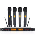 4 channel wireless microphone system with four black handheld mics and rackmount receiver