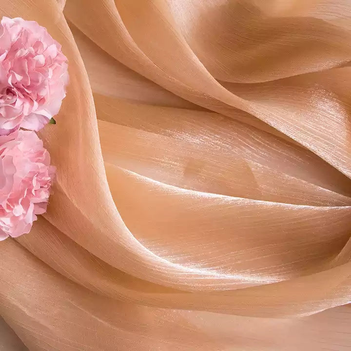 Smooth Silk Mercerized Photography Backdrop in Soft Peach with Floral Arrangement