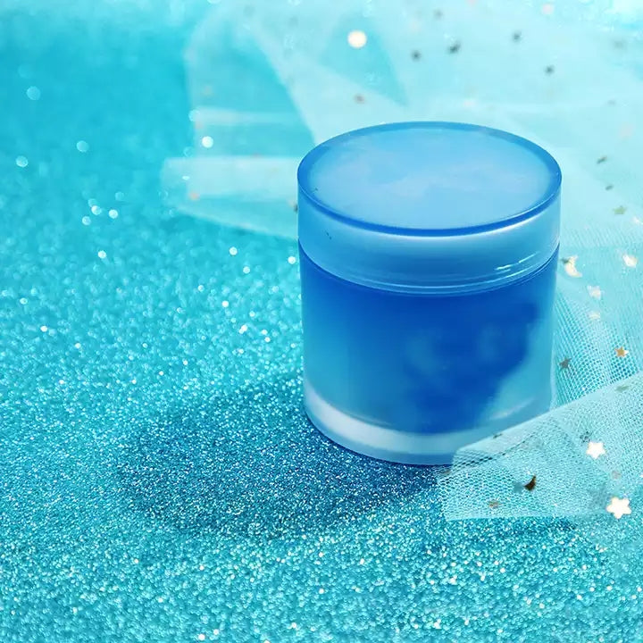 VMIDirect Sparkling Sky Background featuring a blue cream jar on a shimmer surface