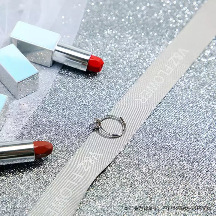 VMIDirect Sparkling Sky Background with lipsticks and decorative elements for stylish product photography