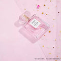 VMIDirect sparkling sky background with a pink perfume bottle and decorative confetti stars