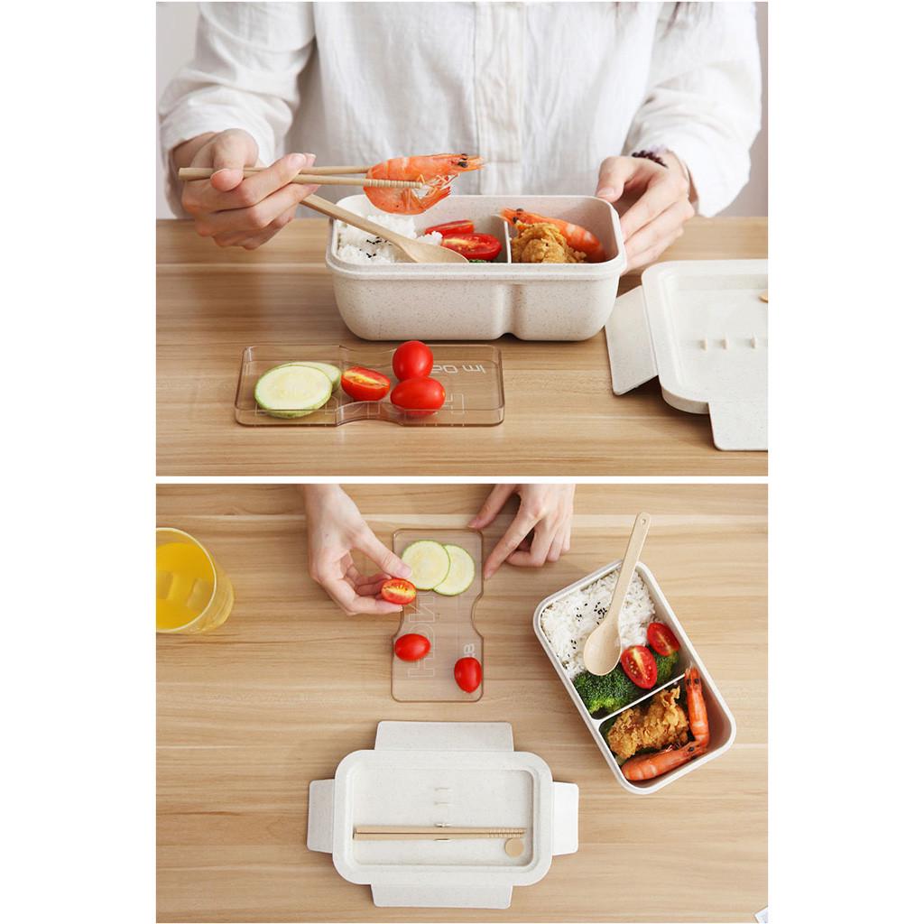 Person enjoying a meal using an 850ml Wheat Straw Rectangular Bento Lunch Box with chopsticks
